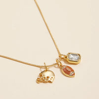Close up view - Gold snake necklace with football, helmet and rectangle clear rhinestone charm