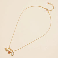 Full view - Gold snake necklace with football, helmet and rectangle clear rhinestone charm